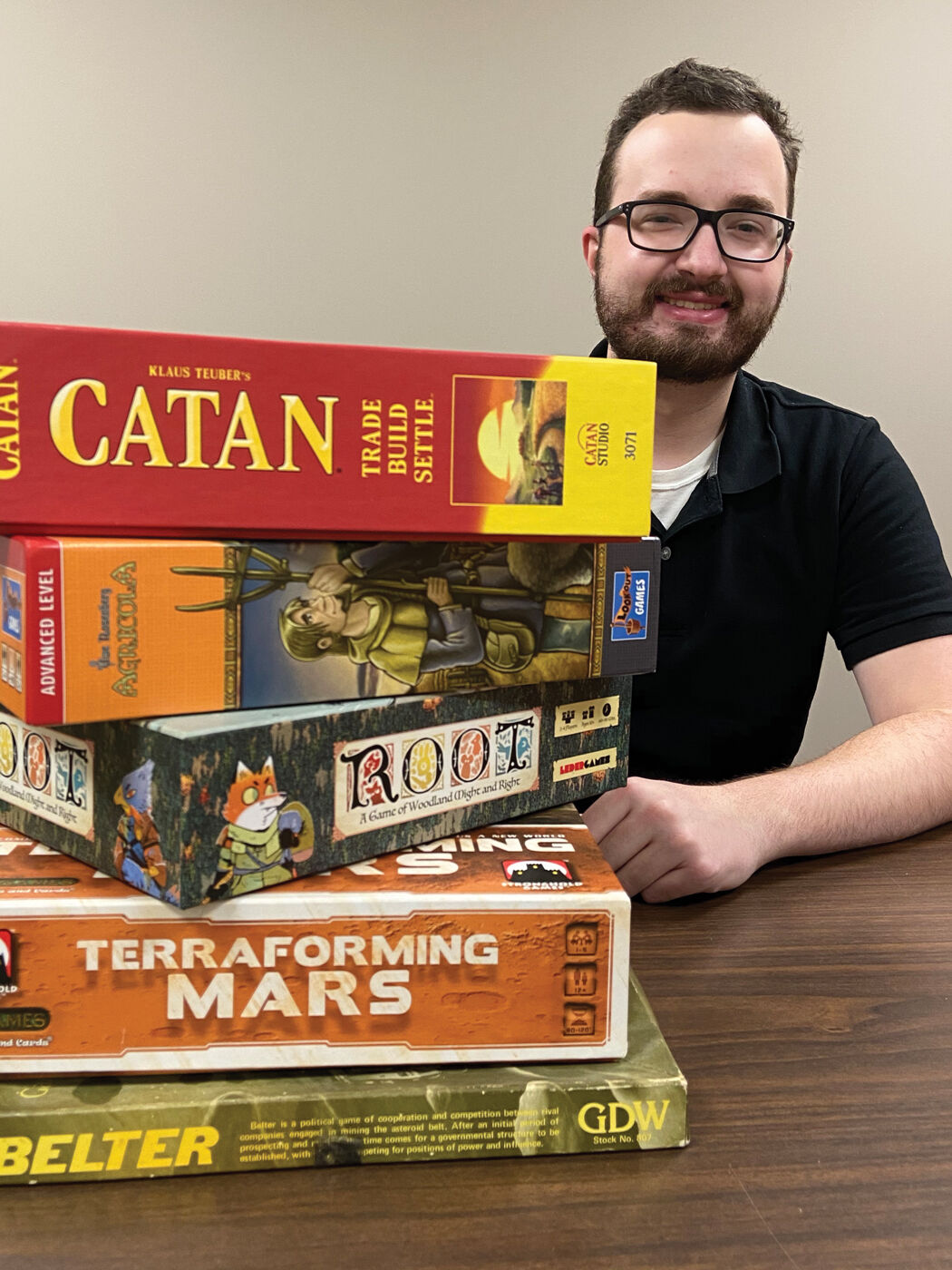 Nathan Madison with collection of board games